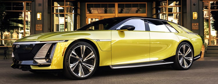 A Yellow Cadillac Celestiq Electric Car Parked in Front of a Modern Building