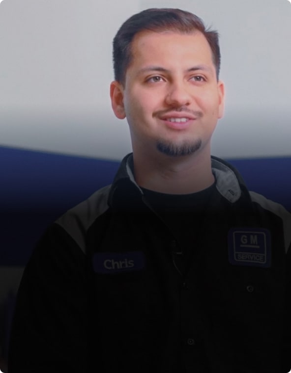 A Man with a Beard and a Mustache Looking Happy While Wearing a Jacket