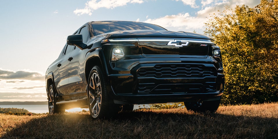 Low Angle View of a Black Chevrolet Vehicle in Front of a Golden Hour Sunlight
