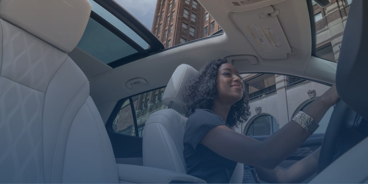 Woman driving GM vehicle