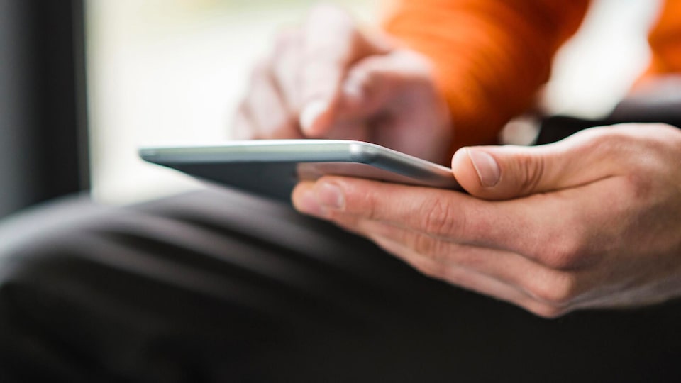 Closeup of Hands Using Smart Phone Device