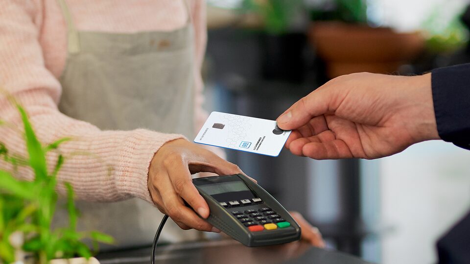Man Using His My GM Rewards Card at Coffee Shop to Earn Points