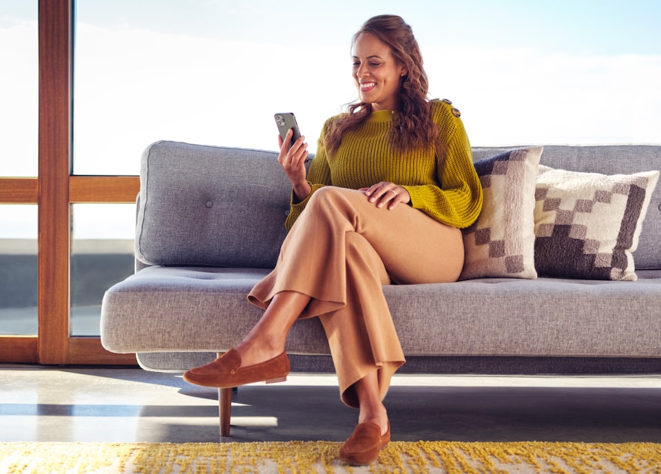 Woman checking her MyGM App