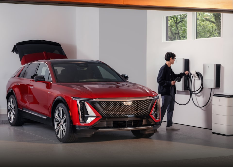 Man Charging his Electric Cadillac Vehicle
