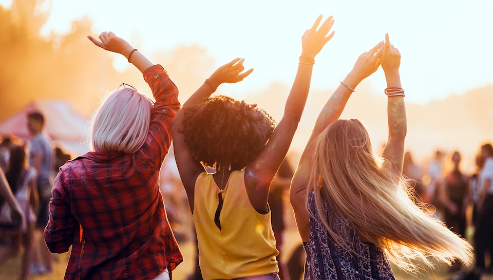 Women Dancing at Summer Outdoor Concert Festival When Using My GM Rewards