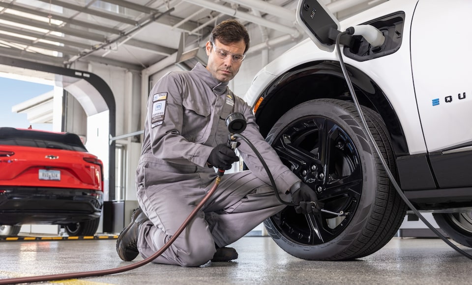 Man working on EV vehicle service