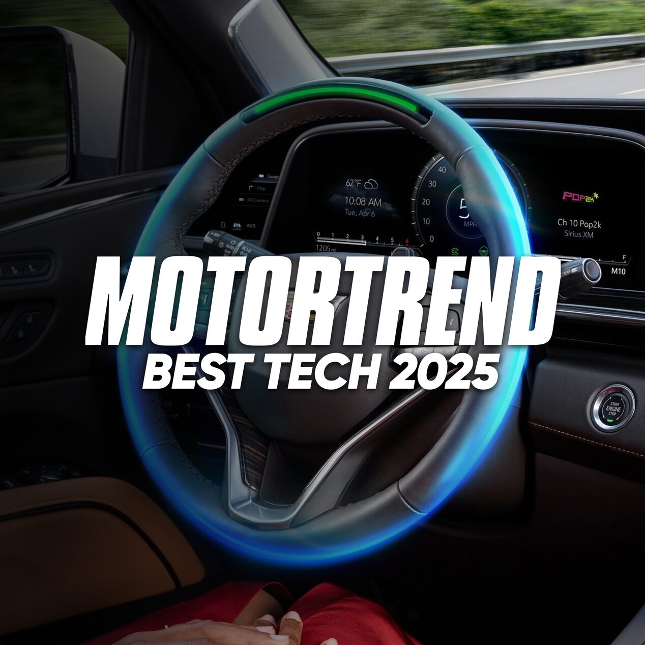 Steering wheel in a vehicle with a text overlay stating "Motortrend Best Tech 2025"