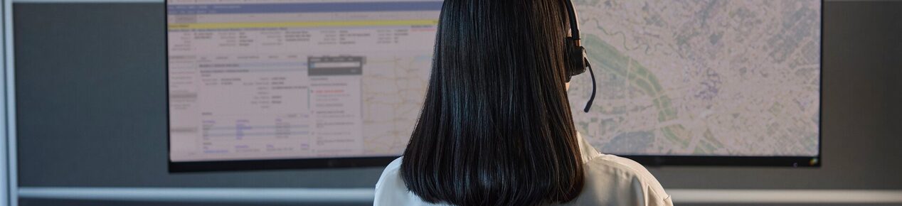 Back of an advisor looking at monitors