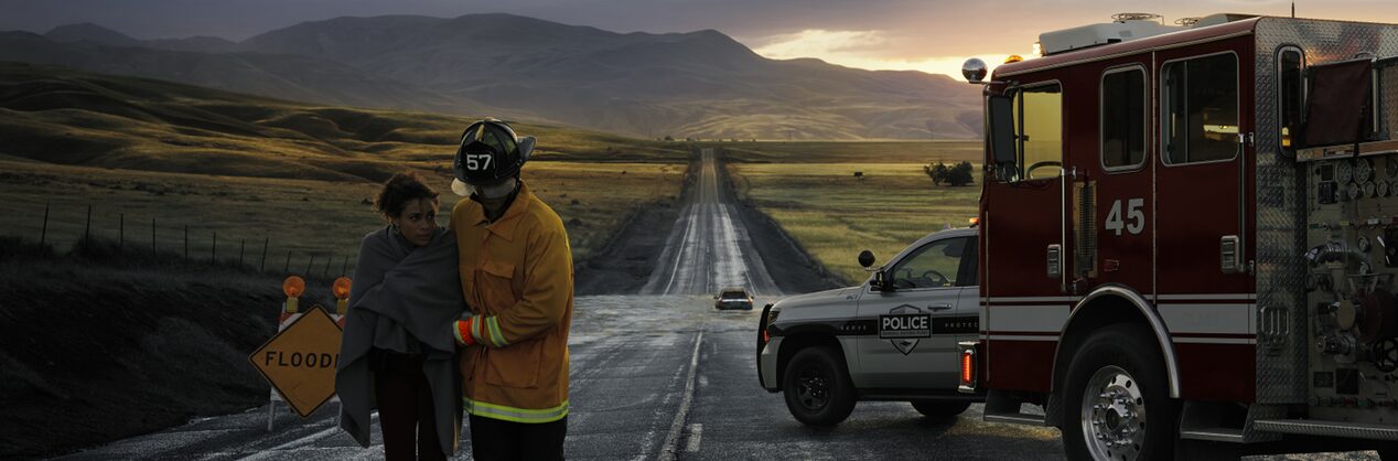 Close-up of a hand with one finger reaching out for the OnStar button