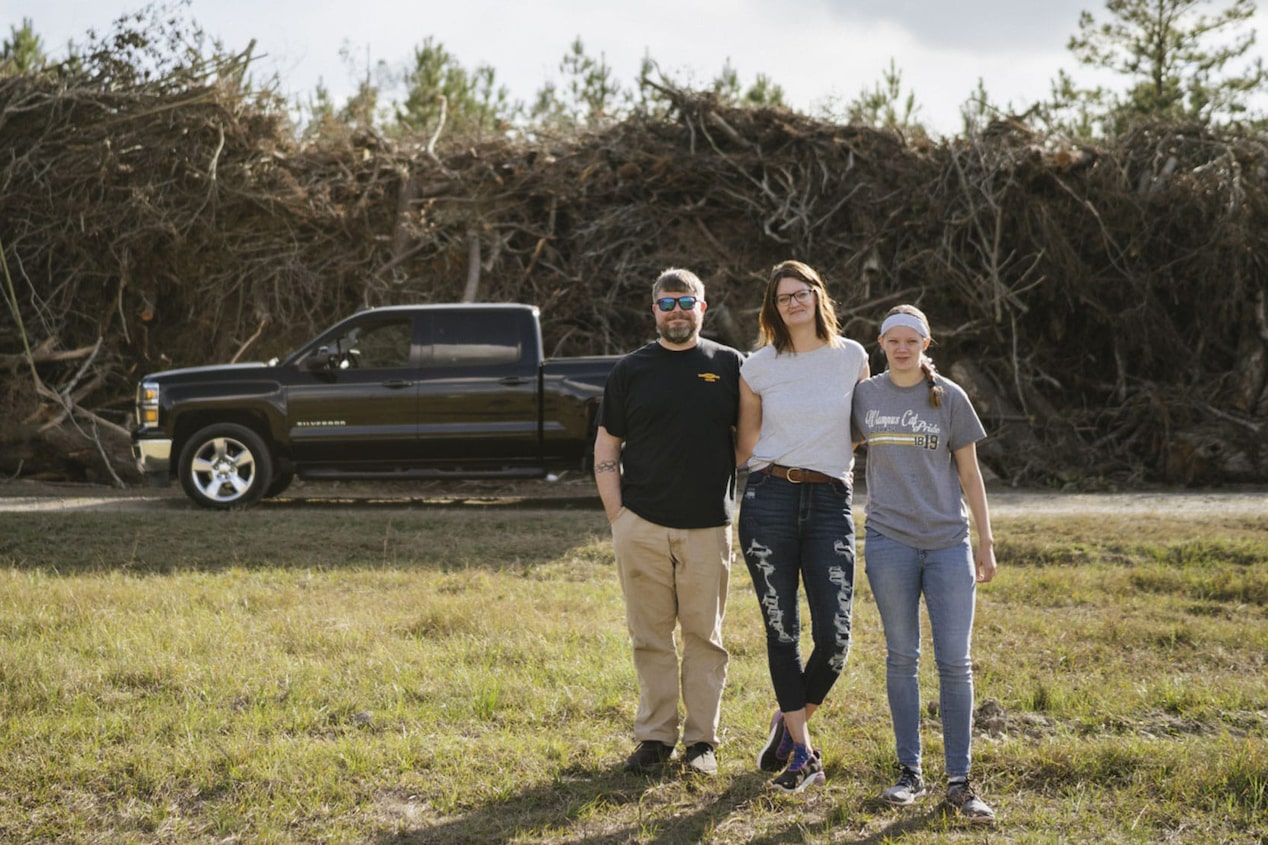 Family in front of GM Truck