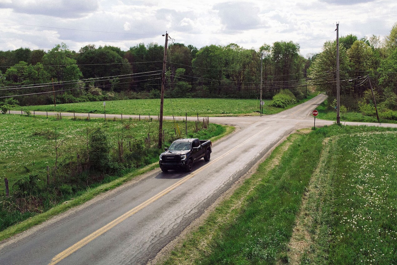 Truck Driving Down Country Road