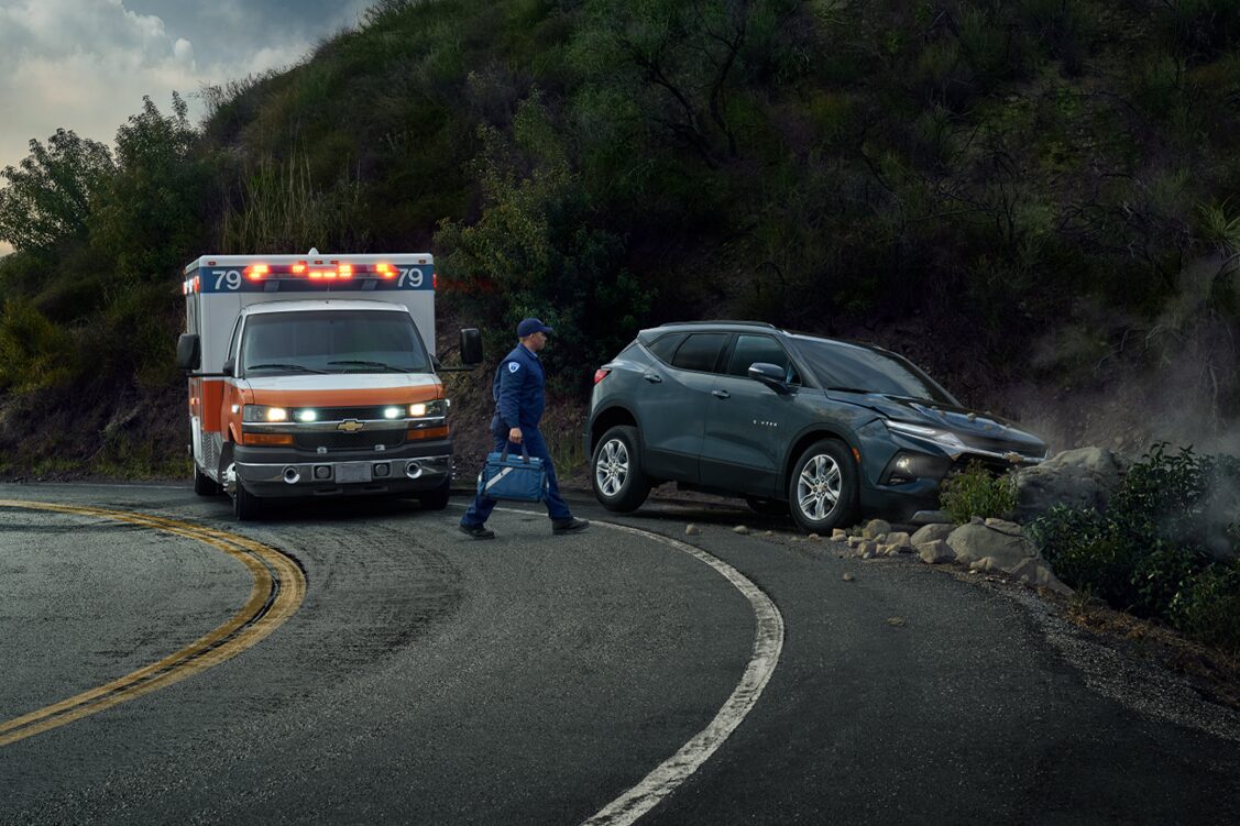 EMT Walking Towards Vehicle on the Side of the Road