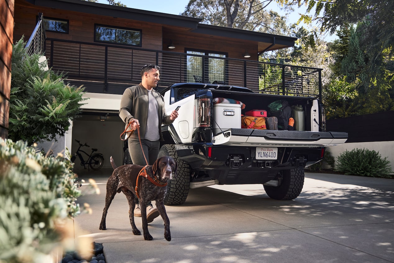 Man Loading Truck Bed for Camping Trip