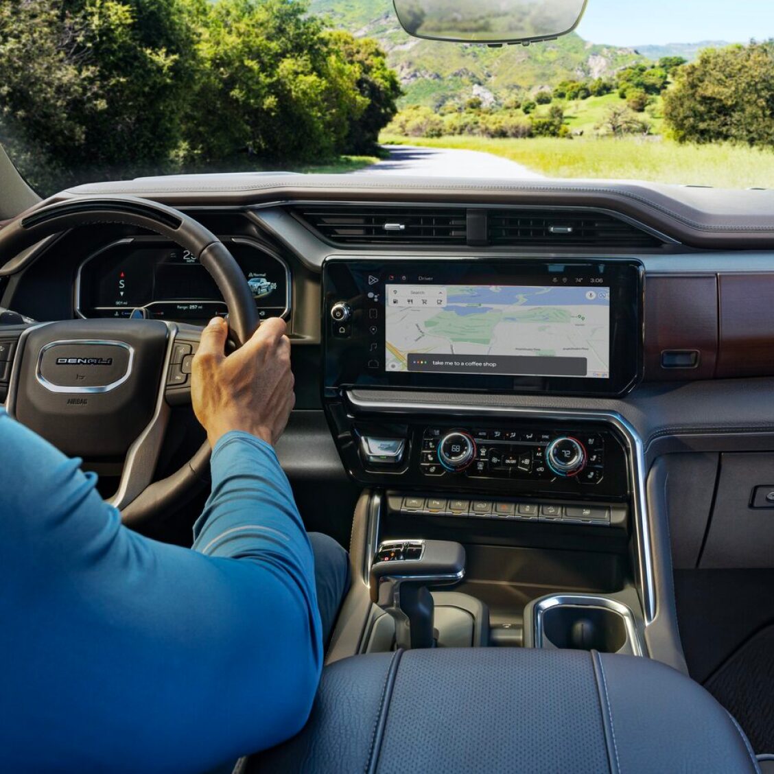 Back seat view of the vehicle's dashboard with Google maps displayed on the infotainment system