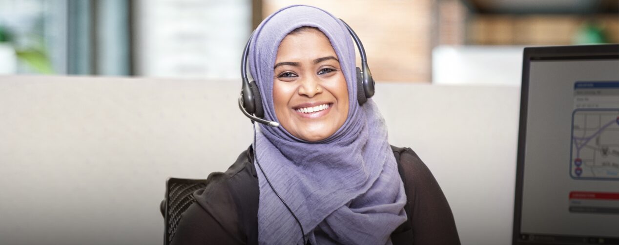 Female OnStar Advisor Smiling at the Camera