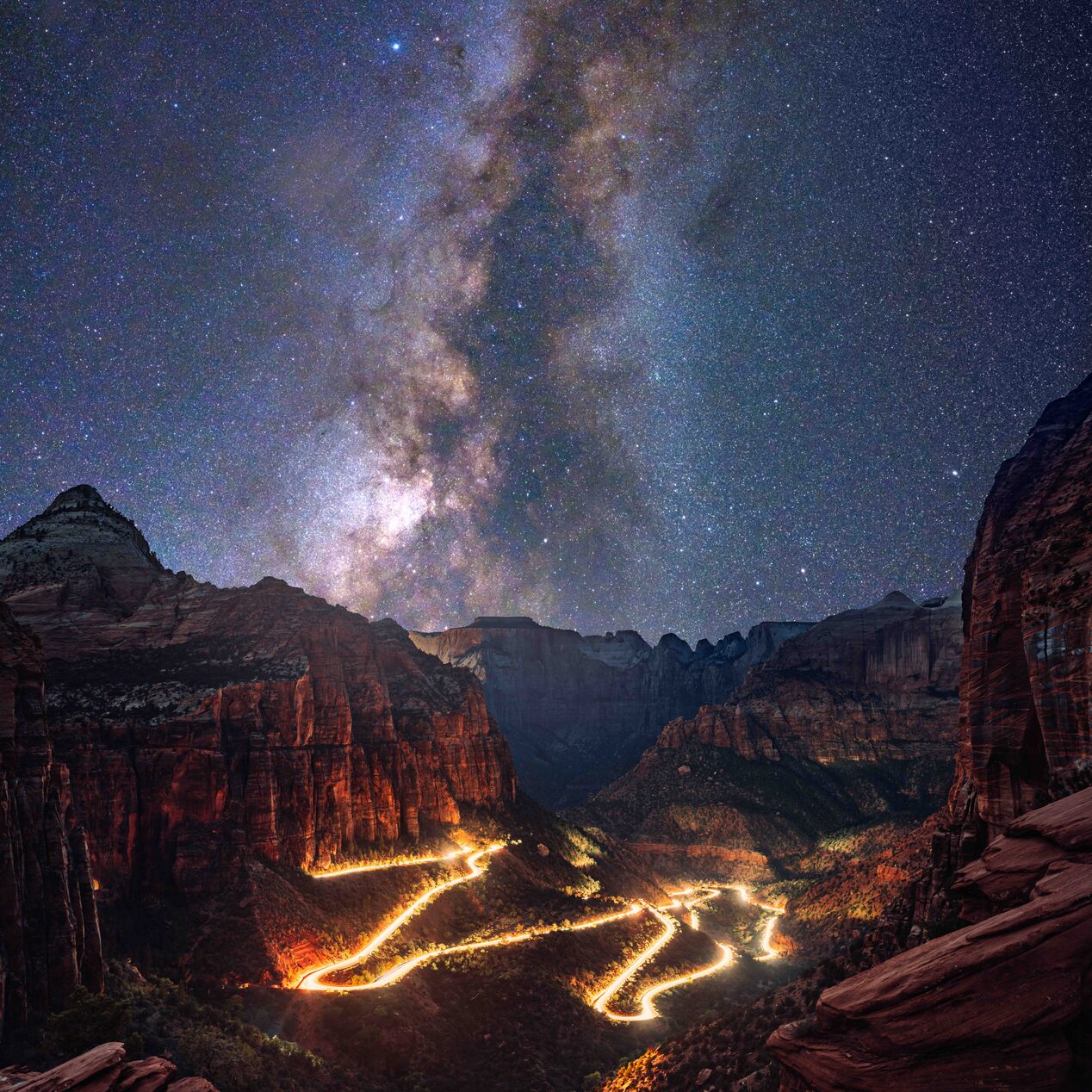 Stary Night View Looking Down on a Lite up Moutain Town