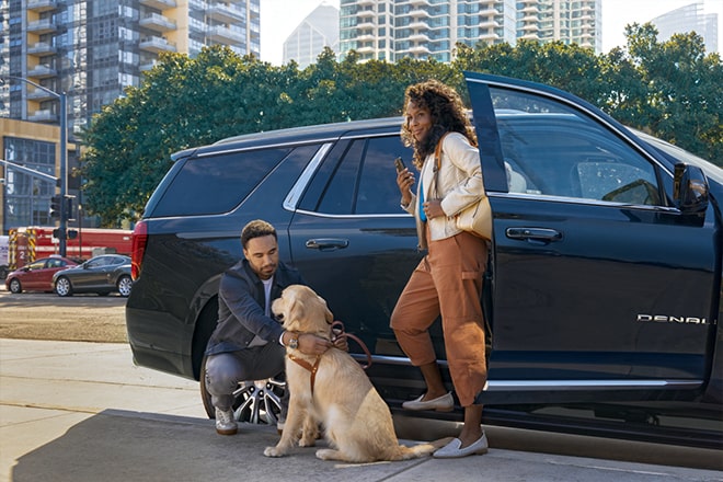 Woman Exiting Passenger Seat of Family Vehicle