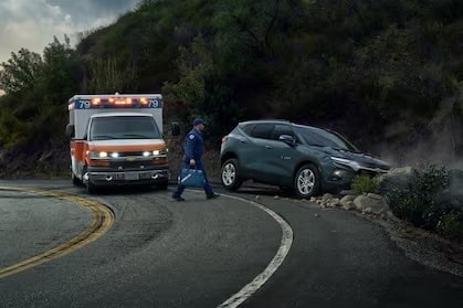 An ambulance arriving on the scene of a car crash