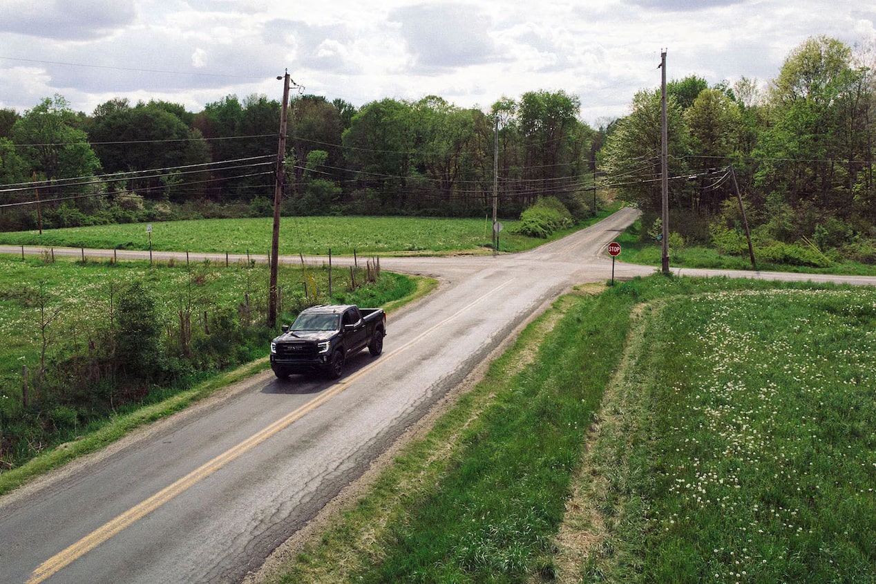 GM Truck Driving Down Road