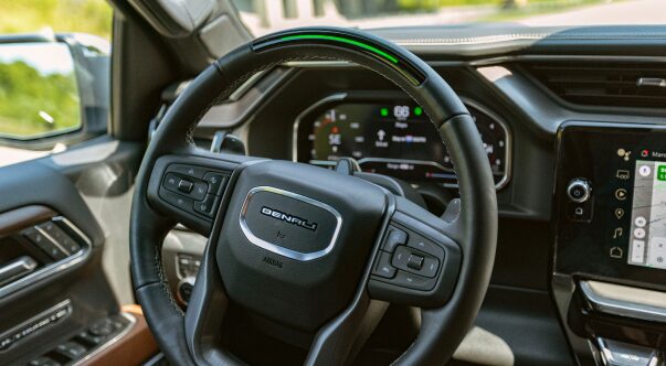 Close-up of the steering wheel of a vehicle on a sunny day