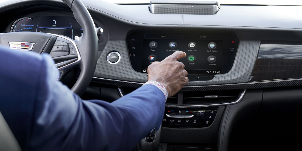 Man Driving Using Infotainment System