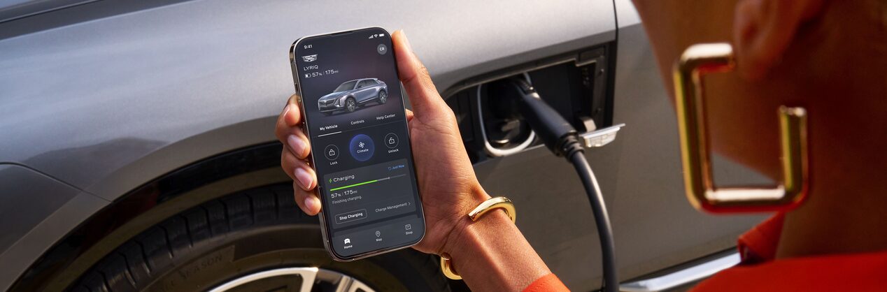 Woman Checking Charge Status of her Cadillac Using myCadillac Mobile App