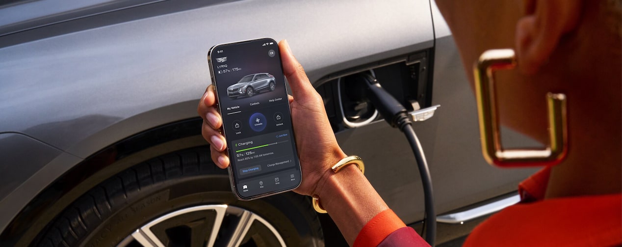 Woman Checking Charge Status of her Cadillac Using myCadillac Mobile App