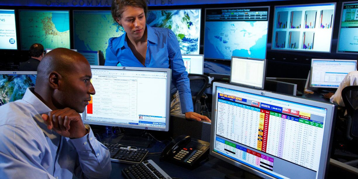 Command Center Workers Manage Rescue Resources on Desktop